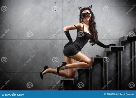 Woman In Catwoman Suit Lying On Stairs Stock Photo Image
