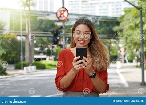 Beautiful Smart Woman With Glasses Using Mobile Phone Walking In Sao