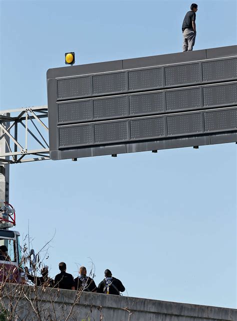 Man Standing On Sign Above Interstate 35 In San Antonio Lured Down