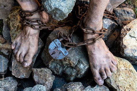 Dirty Slave Legs In Chains Among Stones Slave In An Attempt To Free