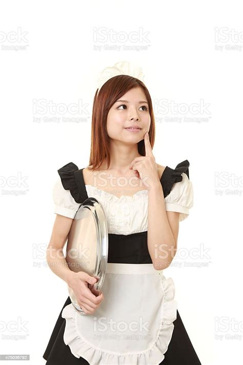 Young Japanese Woman Posing In French Maid Costume Stock Photo