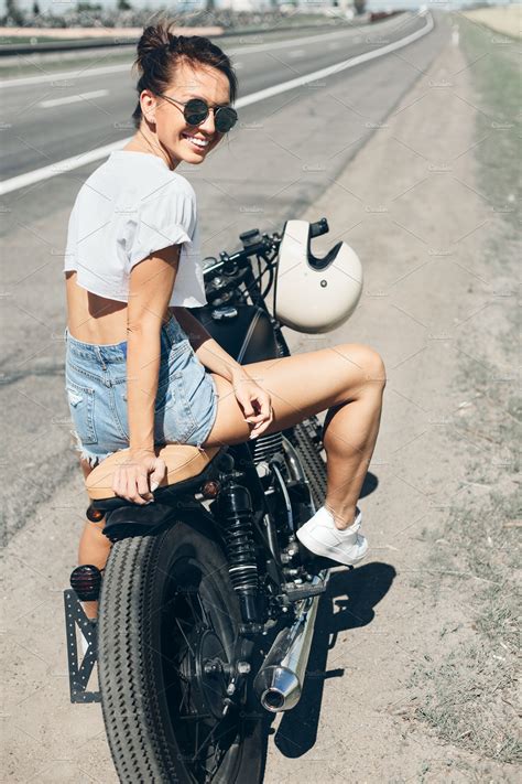 Biker Girl Sitting On Motorcycle Containing Woman Fashion And Retro Transportation Stock