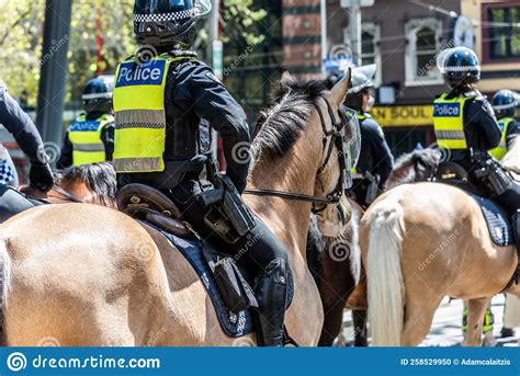 Members Of The Victoria Police Mounted Division Are Attending A Street