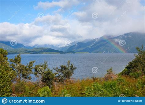 Wanaka Lakefront With Rainbow And Mountains Central Otago New Zealand