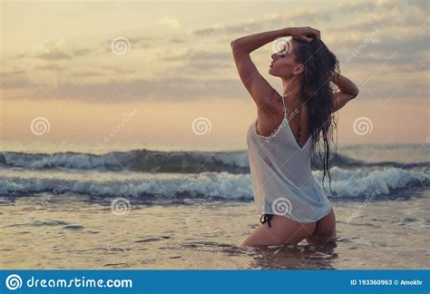 Woman Posing On Beach Near The Sea At Sunrise Stock Image Image Of