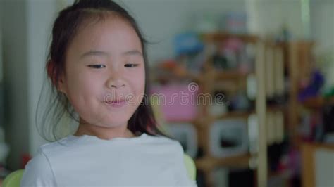 Asian Girl Sucking Lollipop Stock Footage Video Of Camera Looking