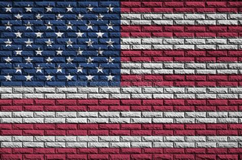 United States Of America Flag Is Painted Onto An Old Brick Wall Stock