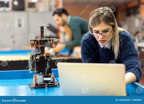 Young Woman Engineer Working On Robotics Project Stock Photo Image Of