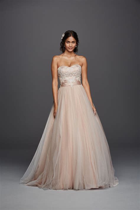 This blush colored Jewel strapless tulle beaded lace wedding dress from