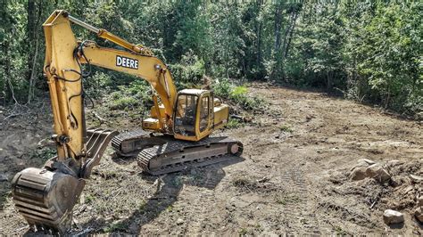 john deere lc excavator clearing trees drone view youtube