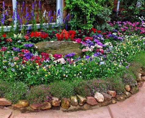 Simply pot your flowers as you usually would and plant the pot into the ground. 33 Beautiful Flower Beds Adding Bright Centerpieces to ...