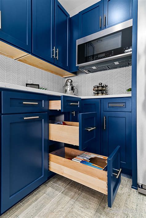 Modern Navy Blue Kitchen With Waterfall Island Colorful