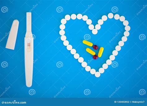 Pregnancy Planning Concep Pregnancy Test Positive With Two Stripes And Contraceptive Pill On