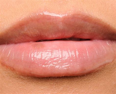 A Womans Lips With Pink Lipstick On Them And The Bottom Half Of Her