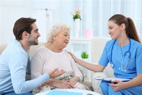 Nurse Talking With Grandmother And Her Grandson Indoors Cna Classes