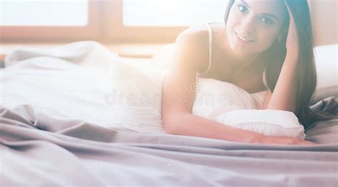 Beautiful Brunette Lying On Bed At Home Stock Image Image Of Face