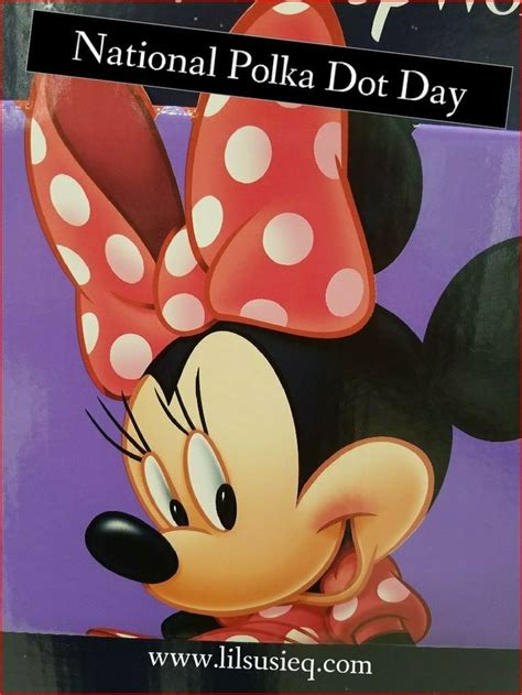 A Close Up Of A Sign With A Minnie Mouse On Its Face And The Words