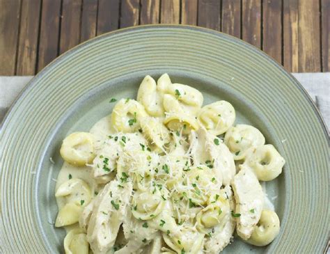Place all ingredients into the crock pot and mix. Crock Pot Chicken Alfredo Tortellini Recipe - Easy Crock ...