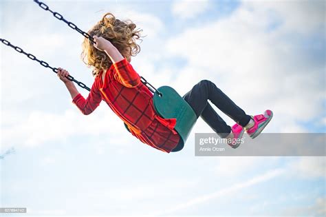Girl Swinging High Into The Air Photo Getty Images