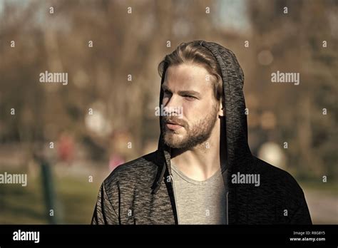 Young People And Emotions Concept Serious Hooded Man Or Boy With Beard
