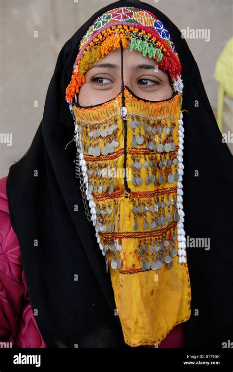A Bedouin Woman In Sinai Is Wearing An Old Traditional Colorful Face