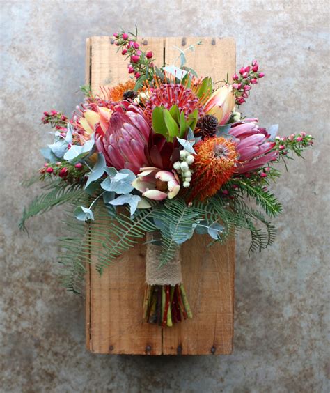 Lily of the valley, hyacinths, tulips, kangaroo paws, gypsophila, nerine, strelitzias. Swallows Nest Farm: Colourful Summer Wedding in Early December