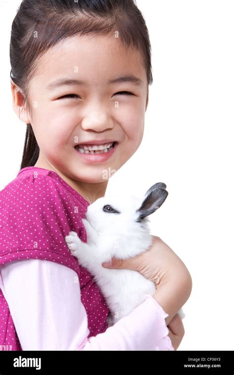 Little Girl Playing With Rabbit Stock Photo Alamy