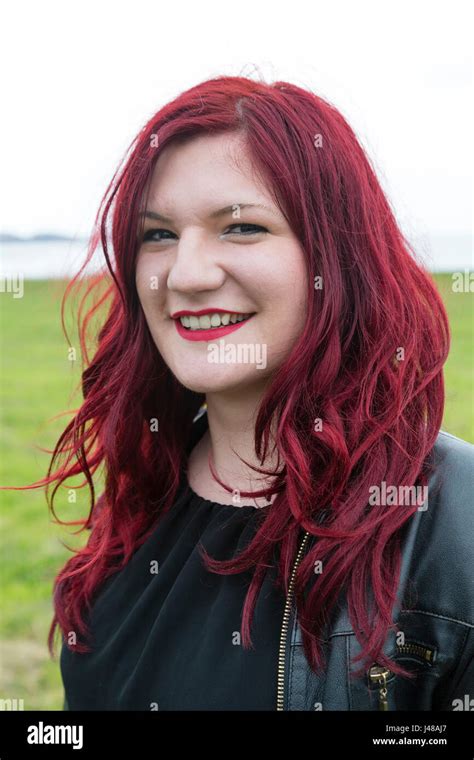 Beautiful Eastern European Woman With Long Dyed Red Hair Stock Photo