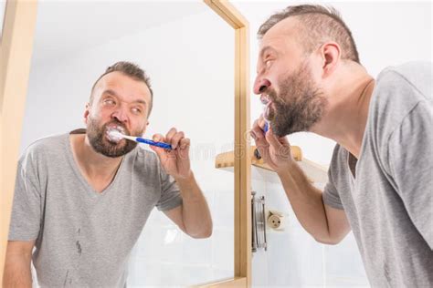 Man Brushing His Teeth In Bathroom Stock Photo Image Of Bathroom