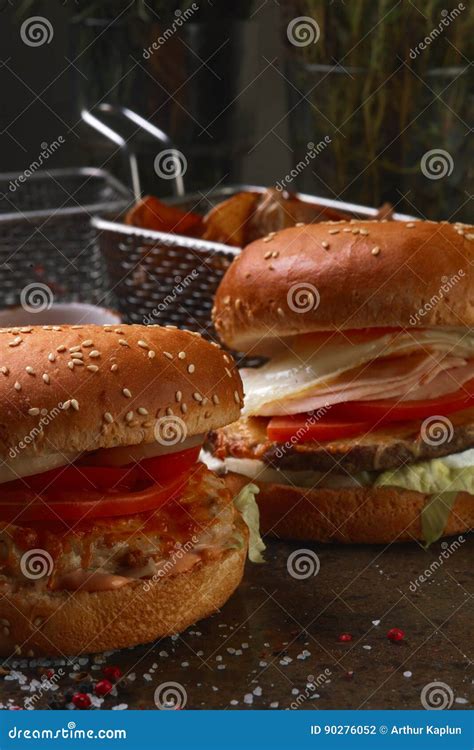 Two Burgers With French Fries And Ketchup Stock Photo Image Of
