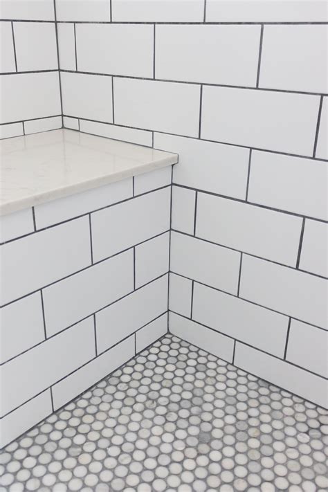 Master Bathroom Shower Subway Tile With Grey Grout Stone Bench And Penny Round Tiles For The