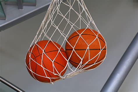 Two Basketball Balls Hanging In Mesh Sack Treating Low T Erectile