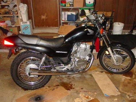 How to remove seat and charge the battery on. 2008 Honda CB250 Nighthawk for sale on 2040-motos