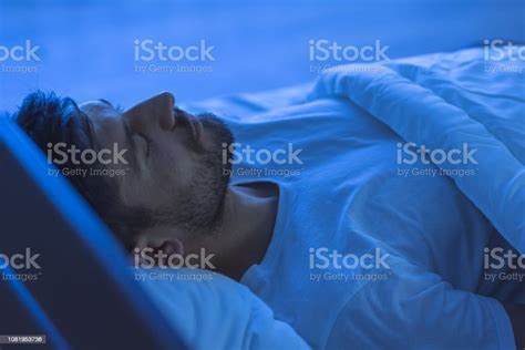 The Man Sleeping In The Bed Night Time Stock Photo Download Image Now