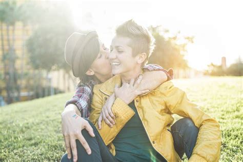 Happy Gay Couple During A Date In Public Park Young Women Laughing