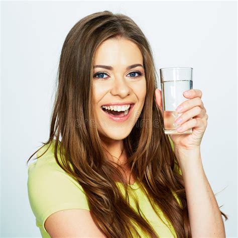 Emotional Portrait Of Young Woman Holding Water Glass Stock Photo