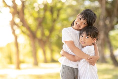 Premium Photo Two Asian Little Child Girls Hugging Each Other With