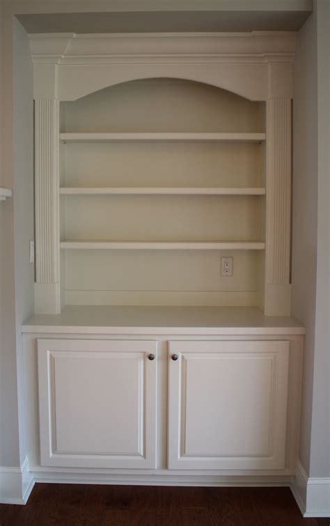 A Traditional Painted Built In Base Cabinet With Bookshelves Built