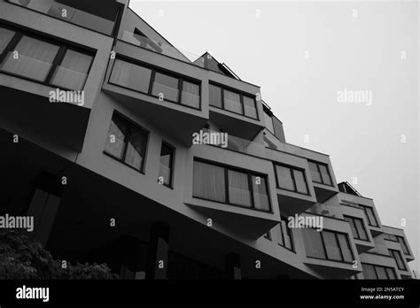 A Grayscale Low Angle Shot Of A Modern Building Facade In Prague