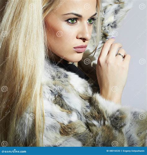 beauty girl in fur coat beautiful luxury winter woman blond girl stock