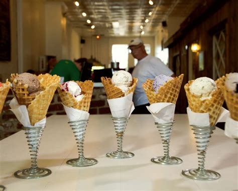 Five Cones Of Ice Cream Sitting On Top Of A Table