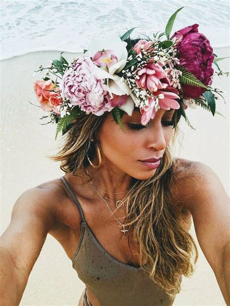 A Woman With Flowers In Her Hair On The Beach