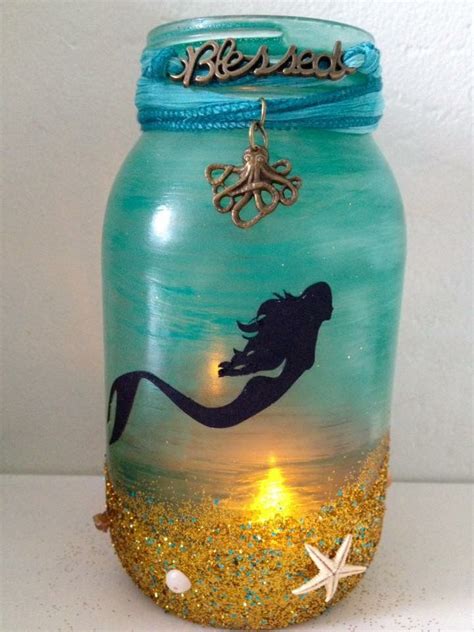 A Glass Jar With An Image Of A Mermaid On It