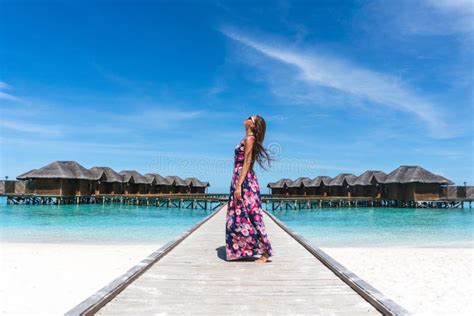 Woman Looking In The Air On Bridge On Beach In Maldives Stock Image