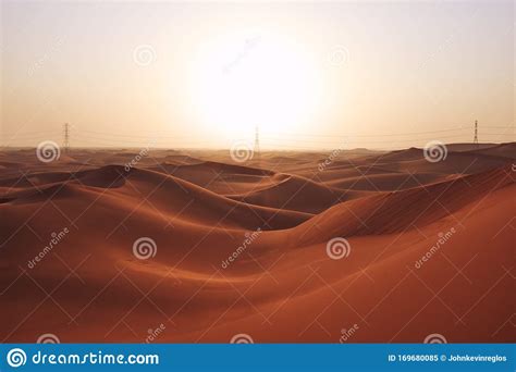 Sunrise In The Red Desert Sand Dunes Of The Arabian Desert Stock Image