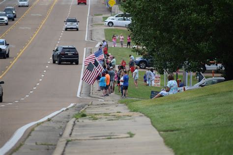 Hundreds Line Roadways To Pay Respects To Fallen Trooper