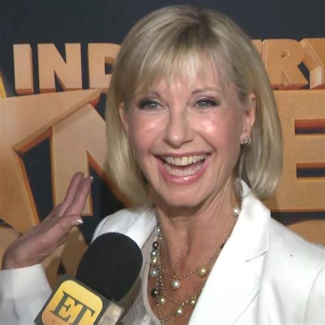 john travolta praises olivia newton john amid cancer battle i m very proud of her exclusive