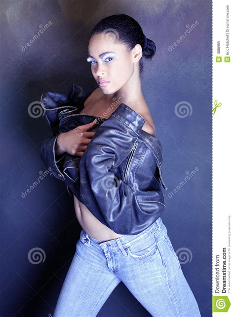 Teenage African American Girl Wearing A Leather Jacket Showing Her