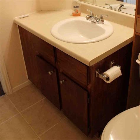 Unfinished wooden cabinet creates a simple line. Refinish Bathroom Cabinets - Home Furniture Design
