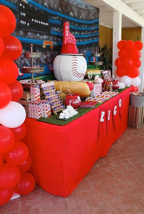 A Baseball Themed Party With Balloons And Decorations